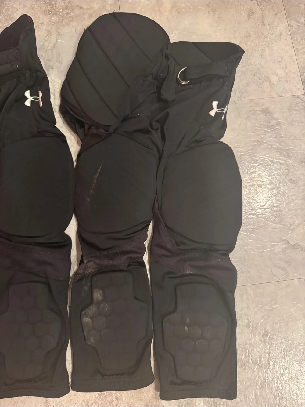 Under Armour youth, small padded, black football pants
